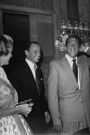 Frank Sinatra and Dean Martin at Sinatra's 42nd birthday party held at the Villa Capri, 1957. Vintage silver gelatin, 14x11, signed. $800 © 1978 Joe Shere MPTV