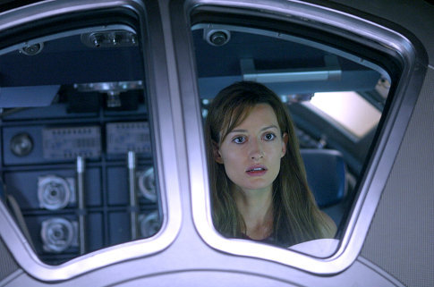 Rheya (Natascha McElhone) cannot comprehend her own sudden appearance on a space station orbiting a mysterious planet.