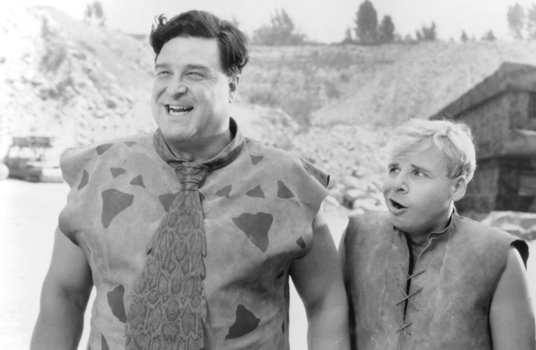 Still of John Goodman and Rick Moranis in The Flintstones (1994)
