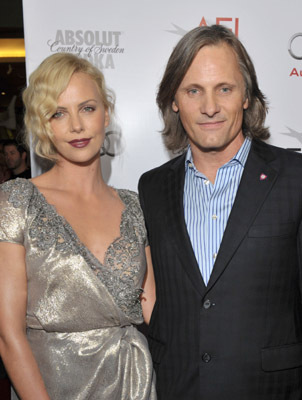 Charlize Theron and Viggo Mortensen at event of The Road (2009)