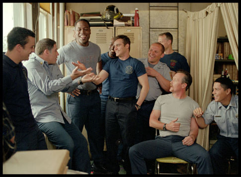 After pulling a prank on a rookie firefighter, Jack Morrison (Joaquin Phoenix, center) jokes with his comrades at the firehouse, including (Left to right) Ray Gauquin (Balthazar Getty), Captain Kennedy (John Travolta,), Don Miller (Kevin Daniels), Tommy Drake (Morris Chestnut), Frank McKinney (Kevin Chapman), Ed Reilly (Robert Lewis), Lenny Richter (Robert Patrick), and Keith Perez (Jay Hernandez).