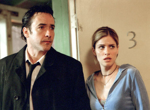 Still of John Cusack and Amanda Peet in Identity (2003)