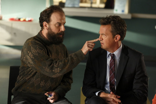 Still of Matthew Perry and Brett Gelman in Go On: There's No 'Ryan' in Team (2012)