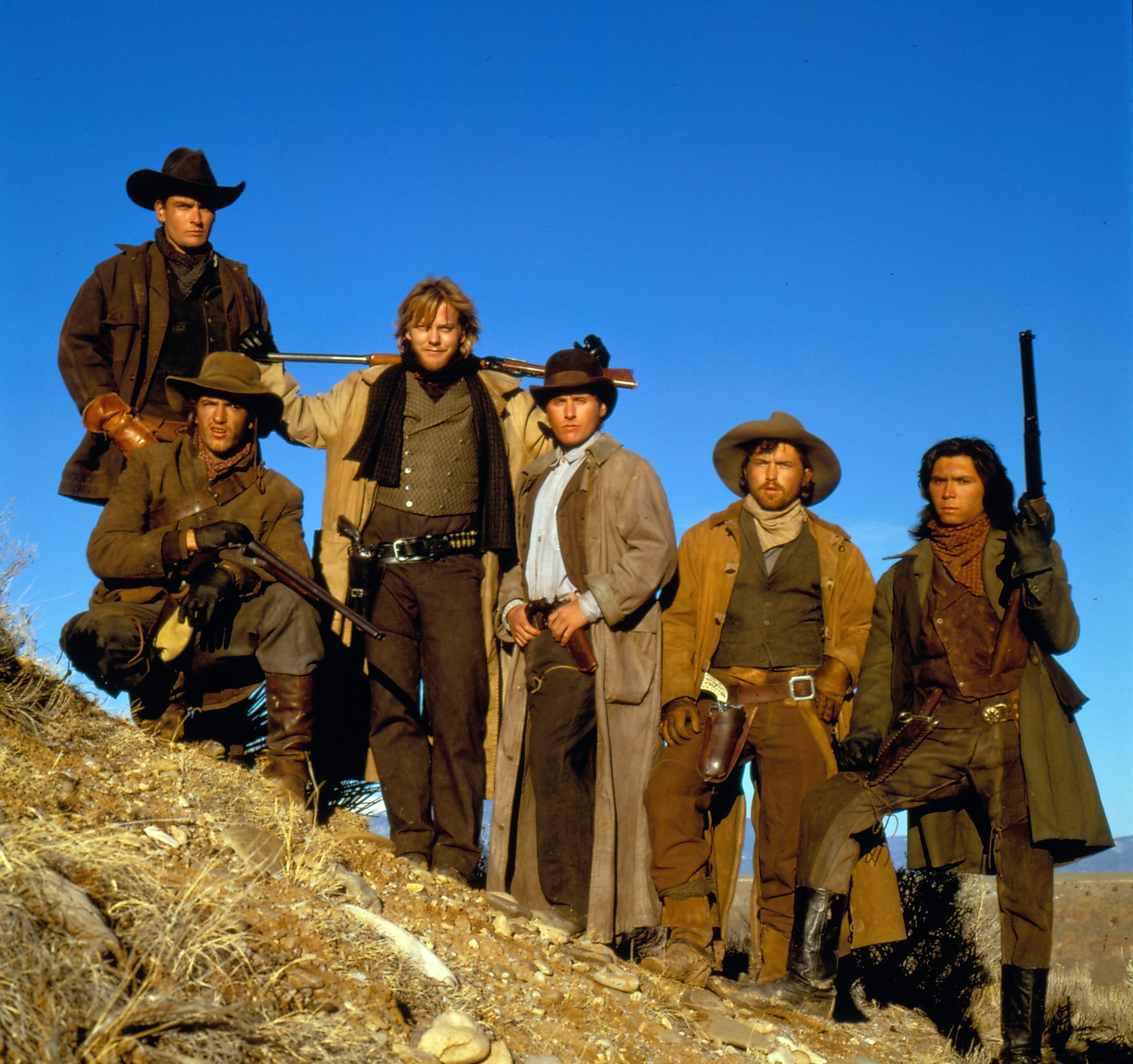 Still of Charlie Sheen, Emilio Estevez, Dermot Mulroney, Kiefer Sutherland, Lou Diamond Phillips and Casey Siemaszko in Young Guns (1988)