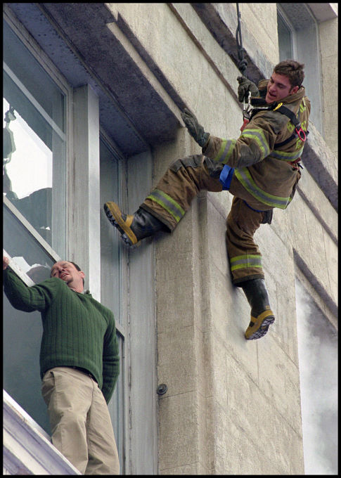 Jack Morrison (Joaquin Phoenix, right) proves his bravery as he risks his life to save a trapped man.