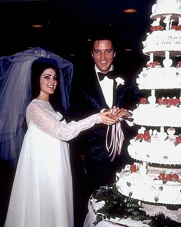 Elvis Presley and his bride, the former Priscilla Ann Beaulieu, cutting their wedding cake in Las Vegas, 5/26/67.