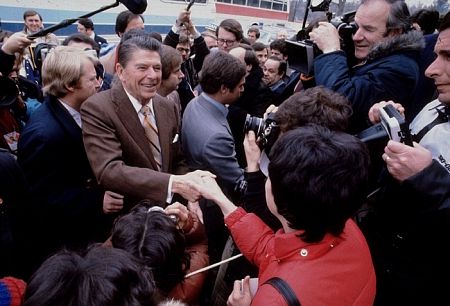 Ronald Reagan greeting a crowd and the press C. 1980