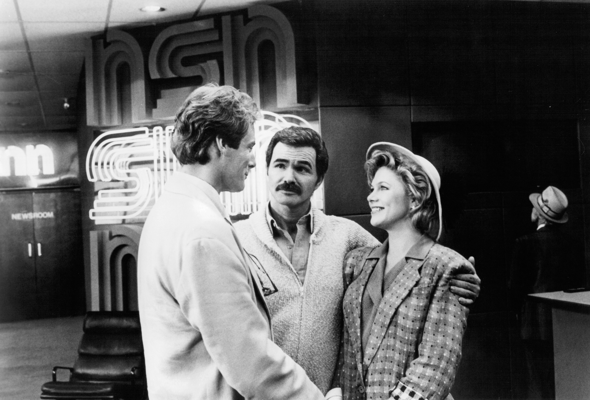 Still of Burt Reynolds, Kathleen Turner and Christopher Reeve in Switching Channels (1988)