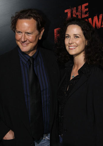 Judge Reinhold and his wife, Amy Reinhold at the Hollywood premiere of The Runaways