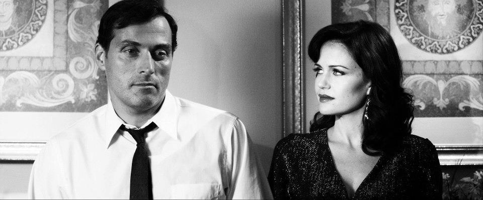 Still of Carla Gugino and Rufus Sewell in Hotel Noir (2012)