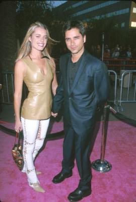 John Stamos and Rebecca Romijn at event of Austin Powers: The Spy Who Shagged Me (1999)