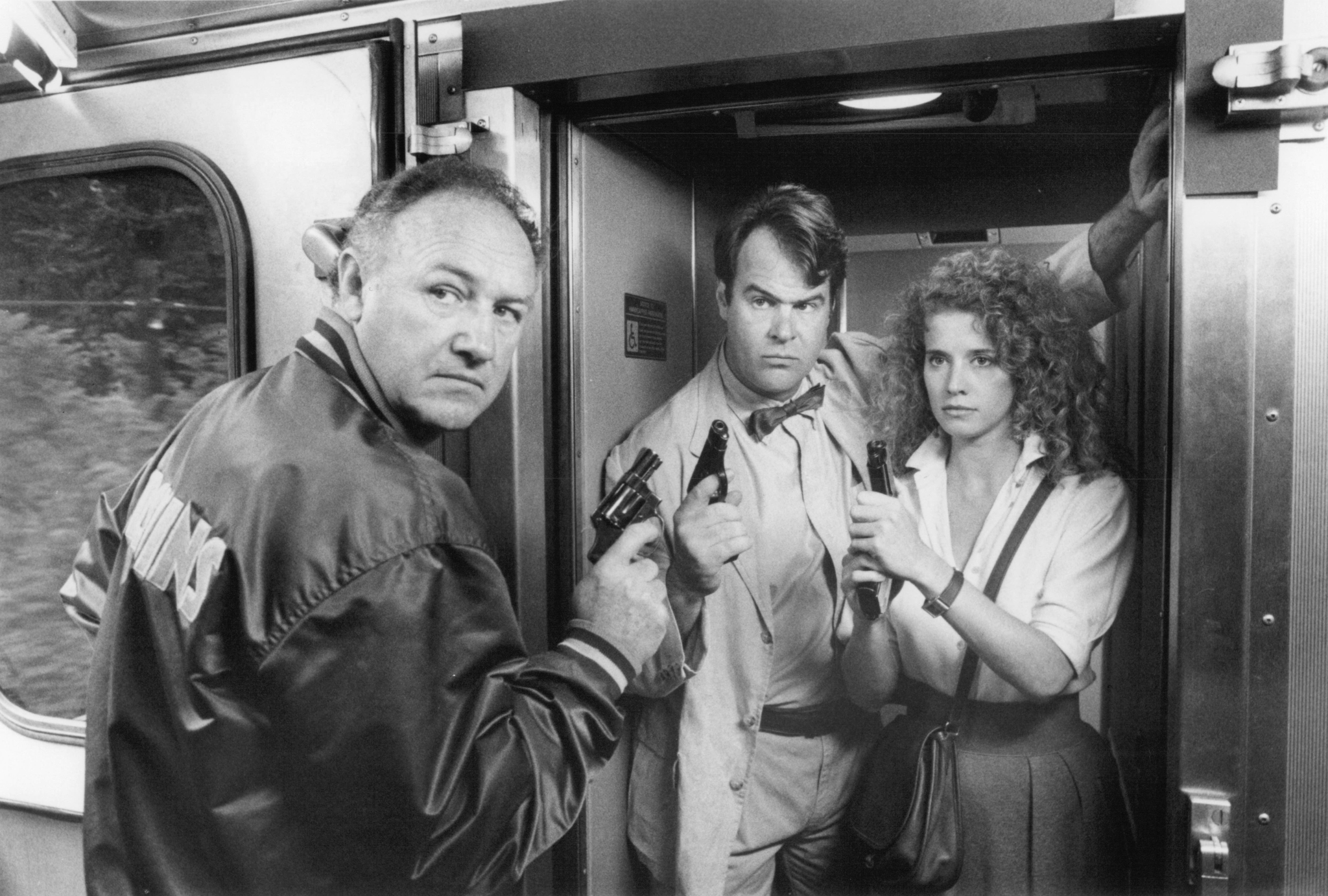Still of Dan Aykroyd, Gene Hackman and Nancy Travis in Loose Cannons (1990)