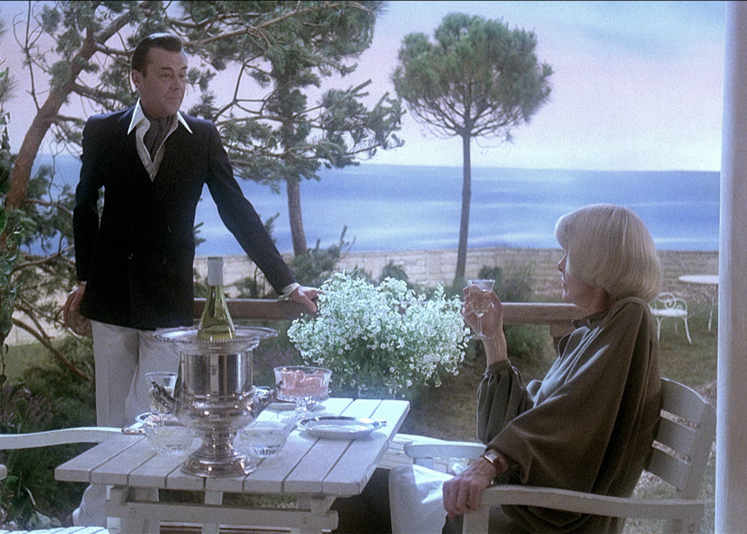Still of Dirk Bogarde and Elaine Stritch in Providence (1977)