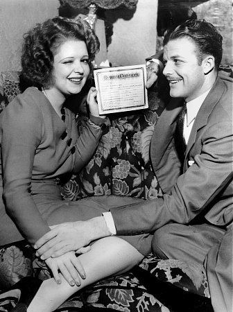Clara Bow with husband Rex Bell holding their marriage certificate, 1931 **I.V.