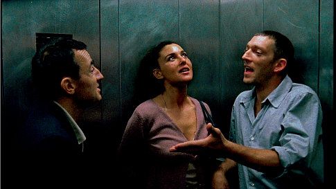 Albert Dupontel as Pierre, Monica Bellucci as Alex, and Vincent Cassel as Marcus in the Gaspar Noé film IRREVERSIBLE.