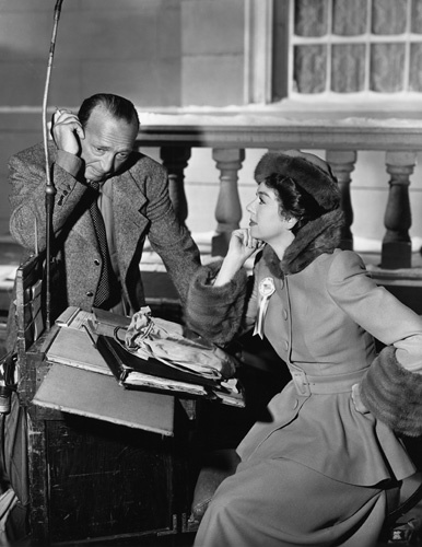 Rosalind Russell and Director Michael Curtiz on the set of 