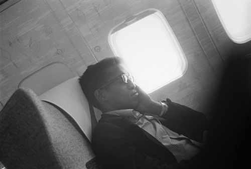 Sammy Davis Jr. resting during a plane trip