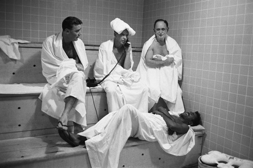 Peter Lawford, Frank Sinatra, Frank's banker Al Hart and Sammy Davis Jr. unwind in the Sands Hotel steam room in Las Vegas