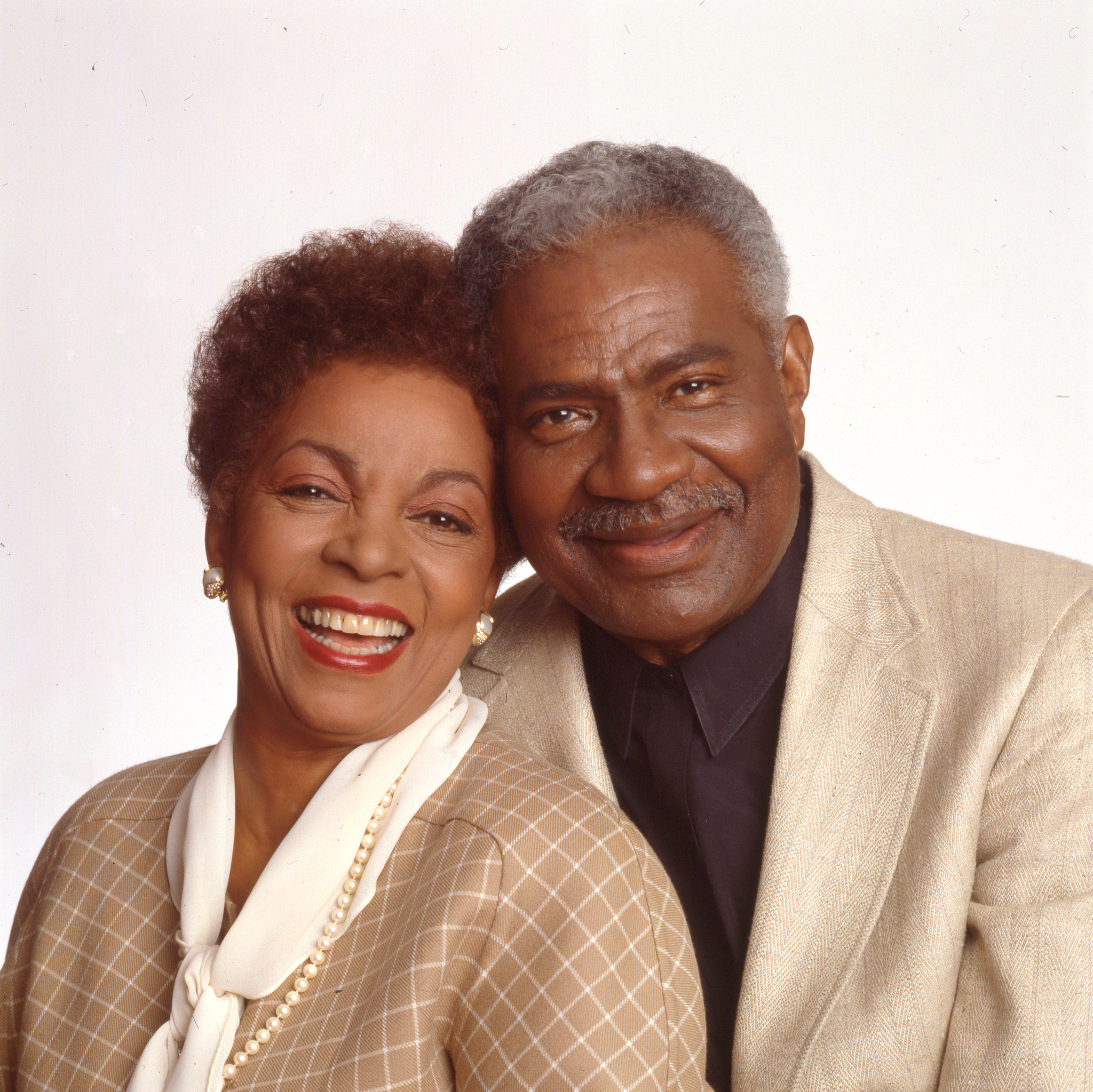 Portrait of married American actors and Civil Rights activists Ruby Dee and Ossie Davis (1917 - 2005) as they pose against a white background, New York, New York, 1980s.