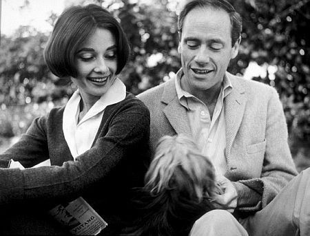 Audrey Hepburn and Mel Ferrer with their pet dog, Famous, outside their home in Los Angeles, CA, 1957.