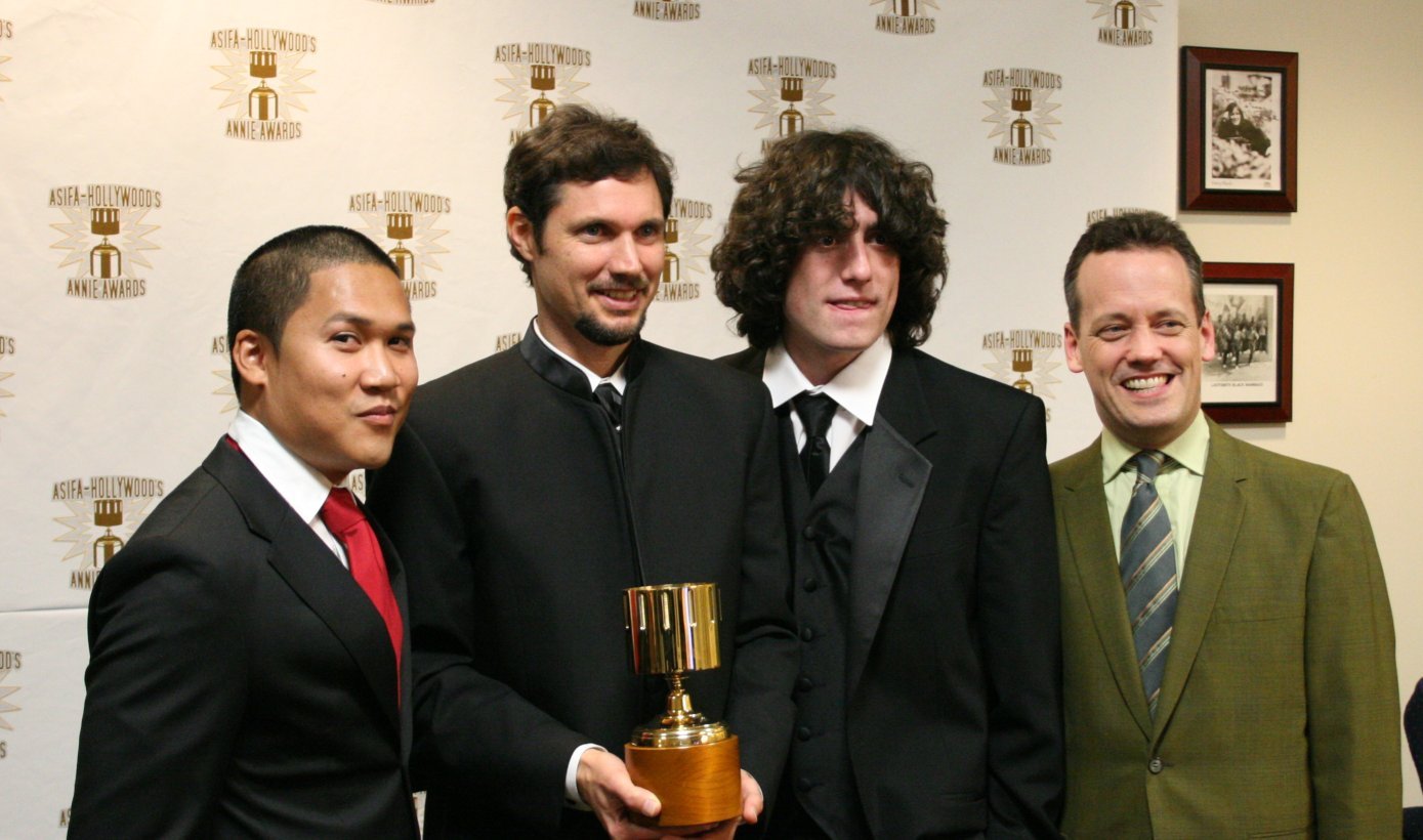 Dante Basco (l), Jack De Sena (3rd from l), Dee Bradley Baker (r) present the Production Artist award to John Clark.