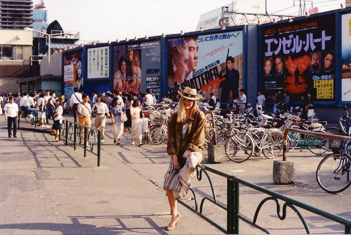 Posing in front of the Billboard of 