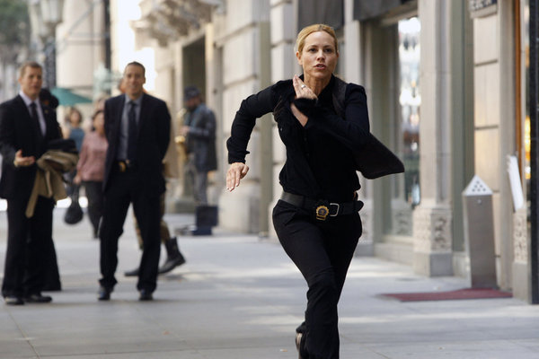 Still of Maria Bello and Kirk Acevedo in Prime Suspect (2011)