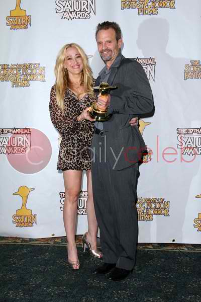 jennifer blanc -biehn and michael biwhn with his saturn award