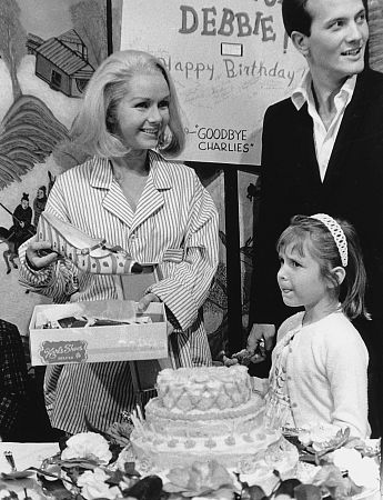 Debbie Reynolds with Pat Boone and daughter Carrie Fisher circa 1965
