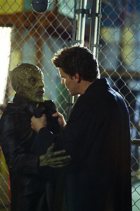 (L-R): Prio Motu (Andy Kreiss) steps from the shadows and attacks Angel (David Boreanaz) who in turn snaps his neck and kills him. From the episode: 