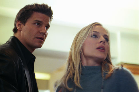 (L-R): Angel (David Boreanaz) encounters Darla (Julie Benz) in the flesh at populated shopping area. From the episode: 