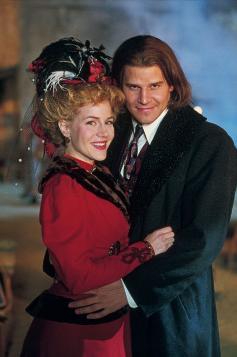 (L-R): Darla (Julie Benz) and Angel (David Boreanaz) in the 1800s. From the episode: 