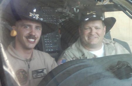 Al-Asad Airbase USO Tour stop, 2003. Teaching Drew how to fly in the Air Cav!