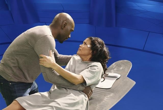 Still of Morris Chestnut and Lourdes Benedicto in V (2009)