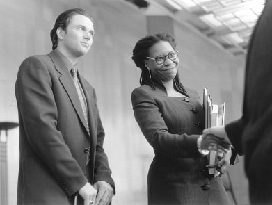 Still of Whoopi Goldberg and Tim Daly in The Associate (1996)