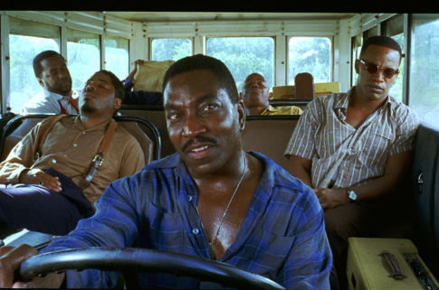 JAMIE FOXX as American legend Ray Charles (far right) and CLIFTON POWELL as road manager Jeff Brown (driving) in the musical biographical drama, Ray.