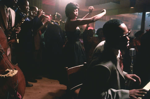 JAMIE FOXX as American legend Ray Charles (far right) and AUNJANUE ELLIS as vocalist Mary Ann Fisher (center) in the musical biographical drama, Ray.