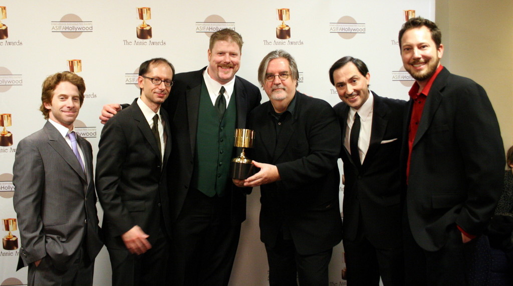 Presenter Seth Green congratulates the winners for best home entertainment production: David X. Cohen, John DiMaggio, Matt Groening, Patric Verrone, Lee Supercinski