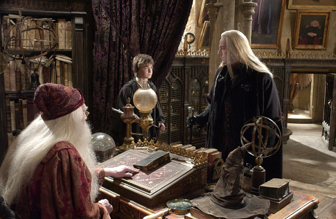 (L-r) Professor Dumbledore (RICHARD HARRIS), Harry Potter (DANIEL RADCLIFFE) and Lucius Malfoy (JASON ISAACS).