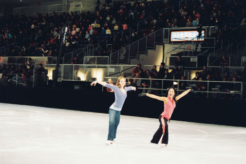 In this behind-the-scenes moment, Michelle Trachtenberg (left) and Michelle Kwan (right) have some fun on the ice.