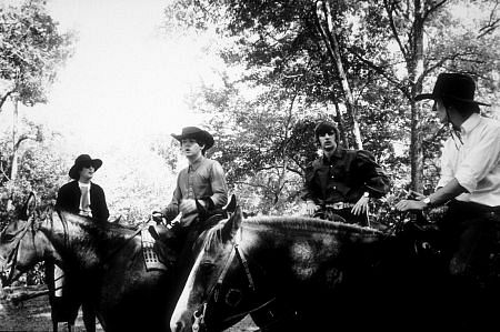 The Beatles ( John Lennon, Paul McCartne, Ringo Starr, & George Harrison) on horseback in Ozarks, Arkansas, c. 1965