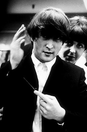 The Beatles, John Lennon and Paul McCartney Backstage fixing John's hair, September 15, 1964