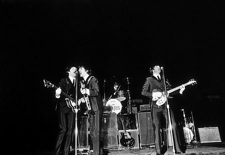 The Beatles (Paul McCartney, George Harrison, Ringo Starr, John Lennon) in performance. c. 1964