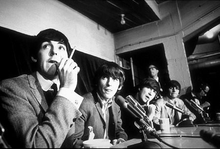 The Beatles ( Paul McCartney, George Harrison, John Lennon and Ringo Starr in press conference) c. 1964