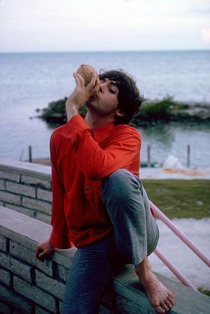 The Beatles, (Paul McCartney jugging the juice out of a coconut), 1964