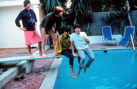 The Beatles ( Ringo Starr, John Lennon, George Harrison, Paul McCartney on the diving board. Geroge and Paul sits and dangles at the edge of the diving board.