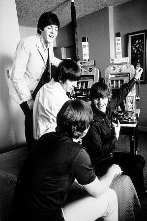 The Beatles ( Paul McCartney, George Harrison, Ringo Starr, John Lennon playing the slot machine)