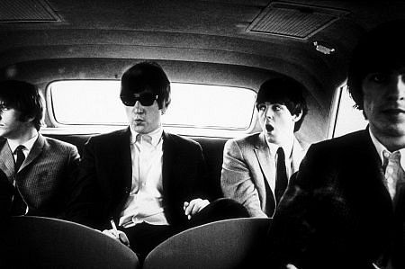 The Beatles (Ringo Starr, John Lennon, Paul McCartney, and George Harrison) inside the car in Denver, Co., c. 1964