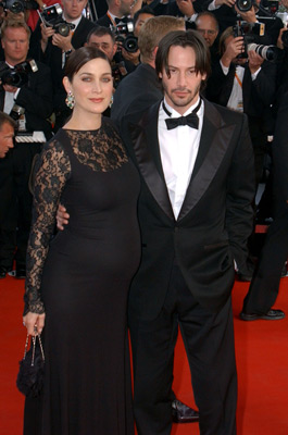 Keanu Reeves and Carrie-Anne Moss at event of Matrica: Perkrauta (2003)