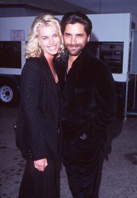 John Stamos and Rebecca Romijn